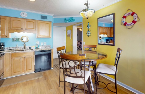 Ocean Isle Beach Condo | Colorful ocean view condo with pool, central AC, & private washer/dryer