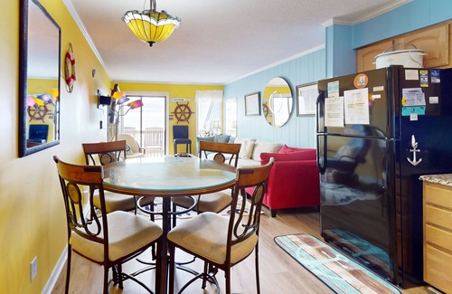 Ocean Isle Beach Condo | Colorful ocean view condo with pool, central AC, & private washer/dryer