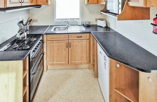 Fishguard House | Comfortable caravan with one double and two twin.