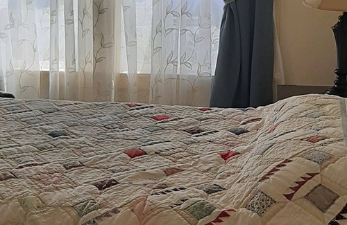 Eureka House | Comfy, clean and secure two-bedroom home with sunroom