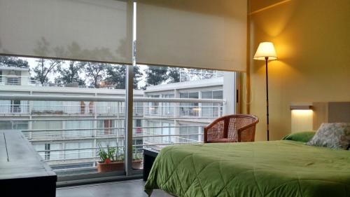La Lonja Apartment | CONCORD PILAR"313 Almendros"50m2 en Suite -living y dormitorio- de 1 a 4 huéspedes