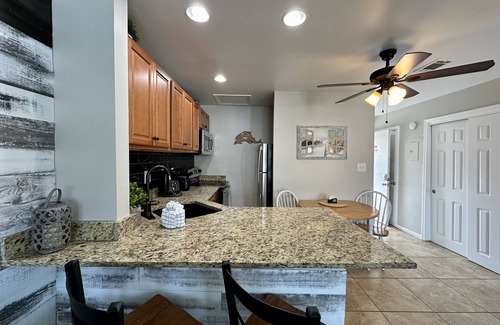 Holiday Isle Condo | Condo #8215 – Overlooks the Sparkling Pool and Features Granite Countertops!