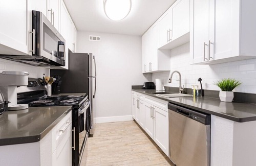 Beach Park Apartment | Contemporary 2BR Stay | Pool, Gym & Grill Area