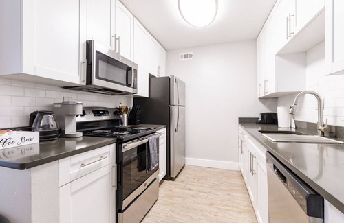 Beach Park Apartment | Contemporary 2BR Stay | Pool, Gym & Grill Area