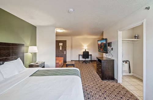 Wichita Hotel | Coratel Suites Deluxe 1 King Suite with Sofa Oversized Non Smoking