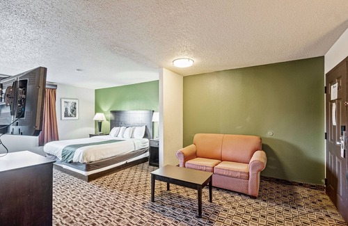 Wichita Hotel | Coratel Suites Deluxe 1 King Suite with Sofa Oversized Non Smoking