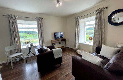 Kilmarnock Cottage | Cosy Country Cottage overlooking its garden and countryside