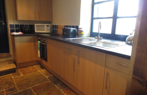 High Peak Cottage | Cottage With Views Over the Peak Forest Canal and Kinder Scout.