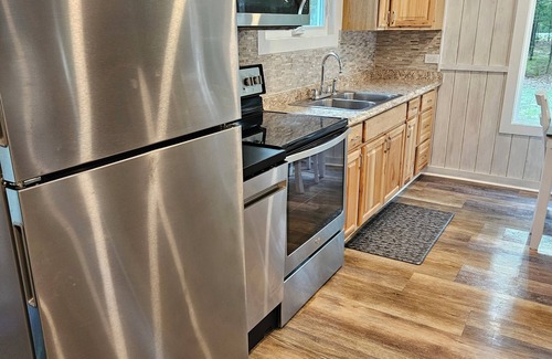 Rapid City Cabin | Cozy 2-bedroom cabin on Rapid River right down the road from Torch Lake