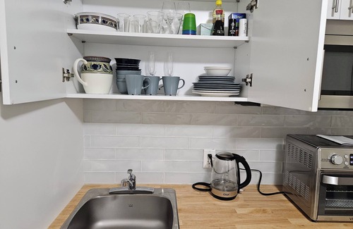 Langford House | Cozy and charming one-bedroom basement suite