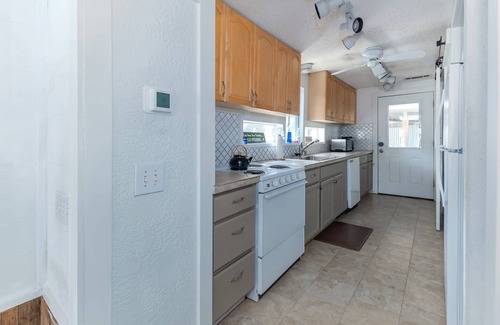 Yacht Harbor Cabin | Cozy Cabin on secluded cove with boat dock, walk to the water, lake views, cowboy pool