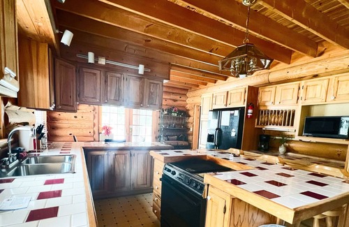 Honor Cabin | Cozy log home with lake access and near the Trading Post. Pet Friendly.