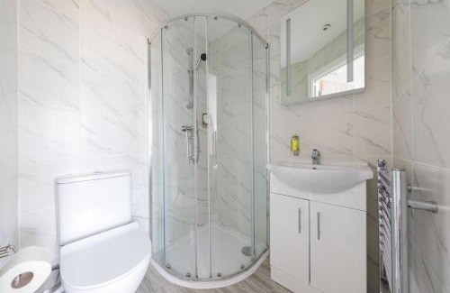 St. George's Apartment | Cozy Rooms with Shared Kitchen and Laundry Area