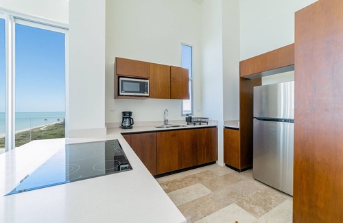 Miramar Apartment | Cozy seaside retreat with shared pool, gym, and stunning views