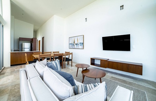 Miramar Apartment | Cozy seaside retreat with shared pool, gym, and stunning views