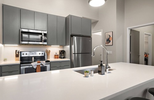 Downtown Minneapolis Apartment | CozySuites Marquee | pool, gym #11
