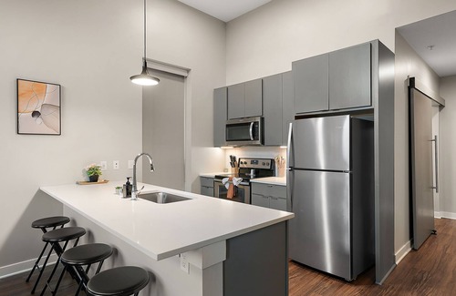 Downtown Minneapolis Apartment | CozySuites Marquee | pool, gym #11