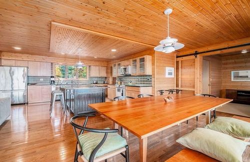 Lake Township House | Custom-designed lake house with screened porch, deck, Ping-Pong & lawn games