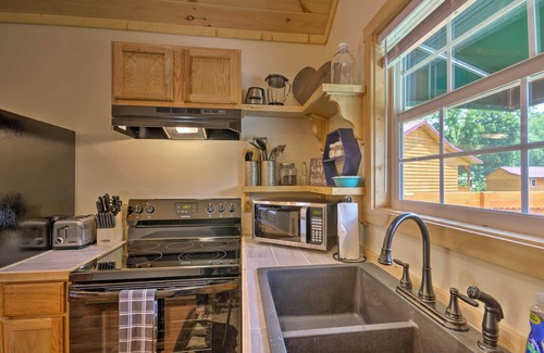 Cherokee Cabin | Deck & Hot Tub: Bryson City Riverfront Cabin!