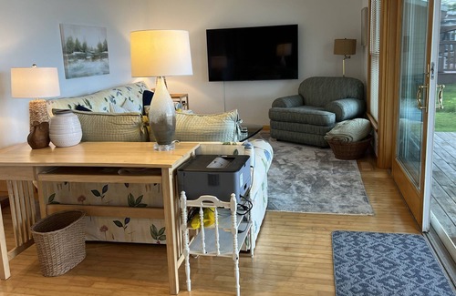 Interlochen Cottage | Delightful sunny beachfront cottage with fire pit 4 min to Concerts!