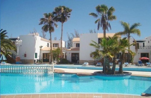 Caleta de Fuste Apartment | DELUXE APARTMENT Your best holidays, three Swimming pool, Private terrace, High WiFi, PUERTA DEL SOL
