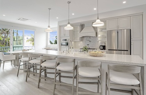 Beach Barber Tract House | Designer Luxury Coastal Home with Panoramic Ocean Views, Rooftop Deck, & Fire Pit
