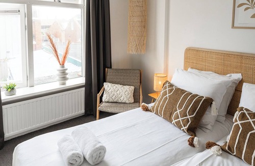 Zoutelande Apartment | Discover the charm of a stylish small seaside room with Ibiza vibes, featuring a private bathroom.