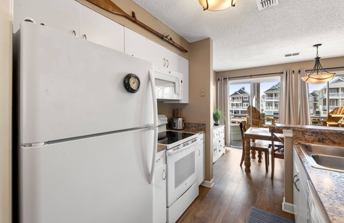 Manteo Condo | Dock Holiday: Canalfront condo, Water Views, Fisherman's dream with Boat Dock