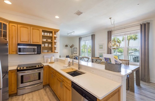 Clearwater Beach Condo | Dock of the Bay-Coastal Elegance, Water Views, Pool, Dock, Walk Everywhere!