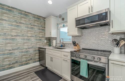 New Smyrna Beach House | Dog Friendly Home w/Private Fenced Yard, Garage & Fire Pit. STEPS to the Beach!