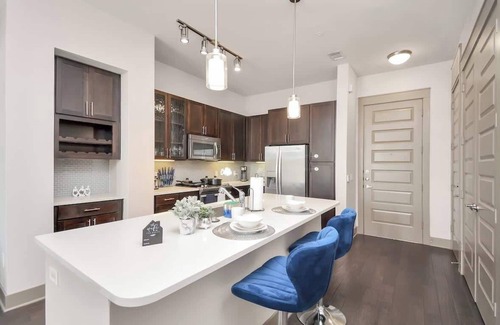 Central Business District Apartment | Downtown Elegance:Upscale Houston Retreat King Bed