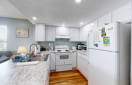Surf City Condo | Dreamy beach condo with pool, easy beach access & furnished balcony with views