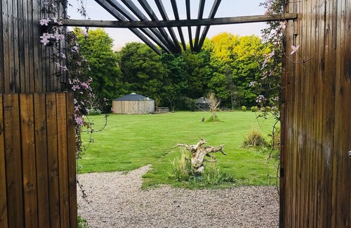 Guisborough RV Rental | Eclipse, a furnished canvas bell tent in field and woodland surroundings