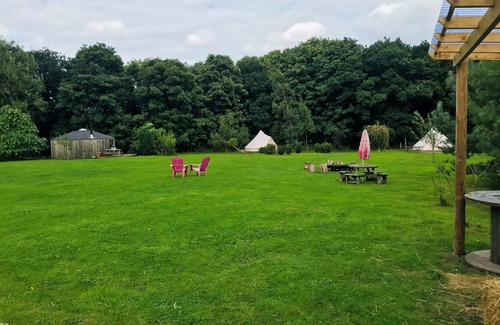 Guisborough RV Rental | Eclipse, a furnished canvas bell tent in field and woodland surroundings