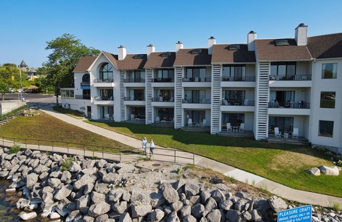 Charlevoix Condo | Edgewater #119 | Water Views + Private Balcony | Pool, Hot Tub, Sauna | Patio