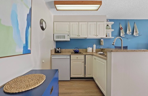 Charlevoix Condo | Edgewater Inn Condo with Waterfront Access | Pool, Hot Tub, Sauna | Sleeps 4