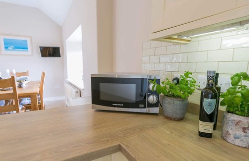 Holyhead Cottage | Efail Penrhyn - an on the beach that sleeps 6 guests in 3 bedrooms
