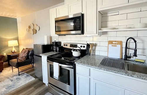 Central Oklahoma City Apartment | Elegant 1-Bed Oasis! Prime Asia District Spot | Stylish Kitchen & Rainfall Shower