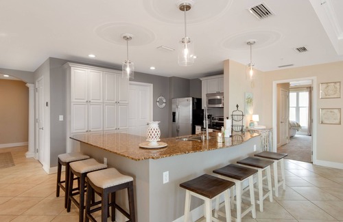 Upper Grand Lagoon Condo | Elegant Fourth Floor Condo with Shared Pool & Hot Tub, Ocean View, and WiFi