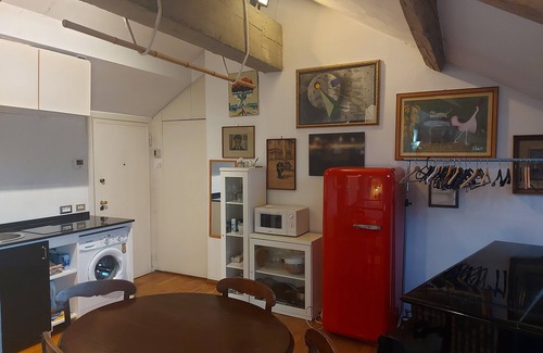 Carrobbio Apartment | Elegant loft with cathedral terrace and park view