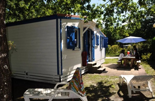 Biscarrosse Ski Chalet | En Chon Les Pins - Camping-Caravaning * - Chalet wood 30m2 2 bedrooms n° 29 SATURDAY/SATURDAY 4 to 5 people - 4 pers. included in the tariff