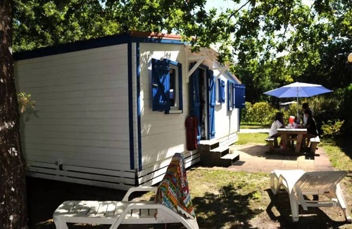 Biscarrosse Ski Chalet | En Chon Les Pins - Camping-Caravaning * - Chalet wood 30m2 2 bedrooms n° 63 SATURDAY/SATURDAY 4 to 5 people - 4 pers. included in the tariff