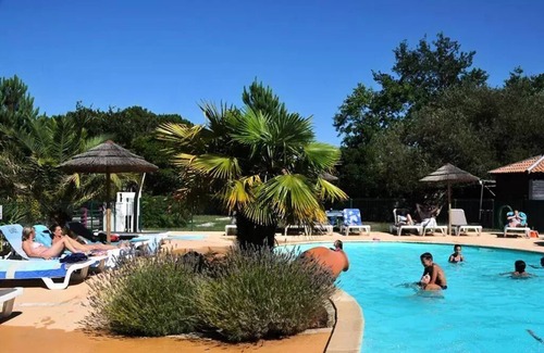Biscarrosse Ski Chalet | En Chon Les Pins - Camping-Caravaning * - Chalet wood 30m2 -2 bedrooms DIMANCHE - DIMANCHE n° 53 4 to 5 people - 4 pers. included in the tariff