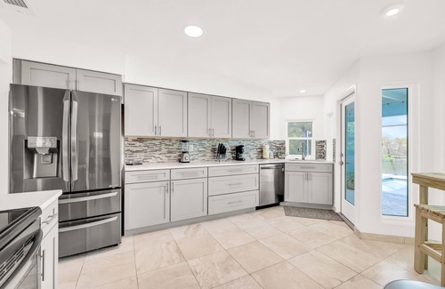 Fort Myers House | Enchanting waterfront home with pool, dock, washer/dryer, & dog-friendly