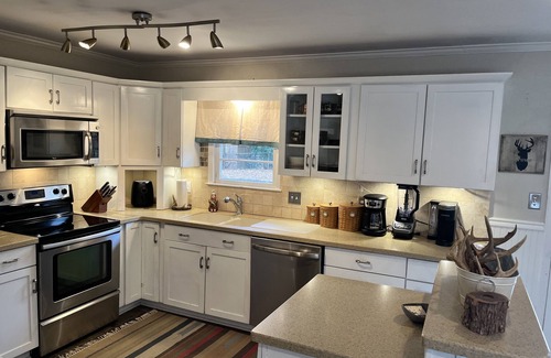 Augusta House | Enjoy the Master’s knowing the hot tub and private backyard await your return.
