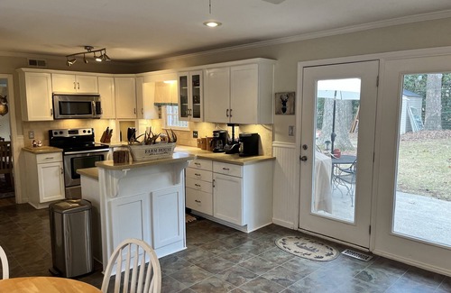 Augusta House | Enjoy the Master’s knowing the hot tub and private backyard await your return.