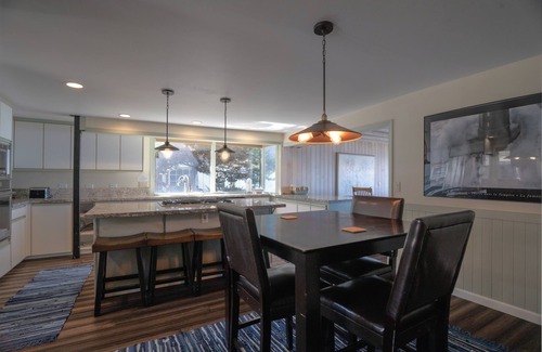 Roads End House | Enjoy the waves in the hot tub at this beachfront home with direct beach access