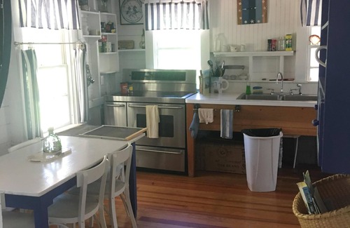 Silver Beach Cottage | Escape to Costal Comfort. Step Back In Time at this Waterfront Retreat!
