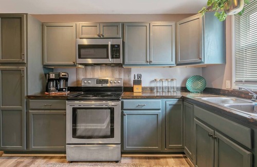 Terry Sanford House | "Escape to Ellis Hideaway: Cozy 2-Bedroom Retreat with 1.5 Baths