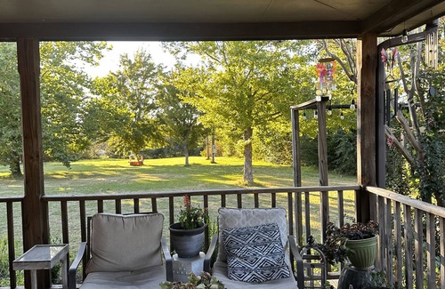 Oxford House | Escape to Serenity: Cozy Ranch Style Home with Charming Wrap-Around Porch.